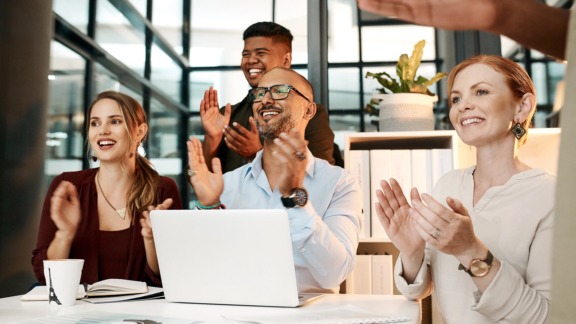 Stock Image of People clapping to a presentation